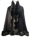 Soft black faux fur poncho cape with a luxurious fur collar and trim, perfect for adding elegance to any outfit in Long Island boutique fashion.