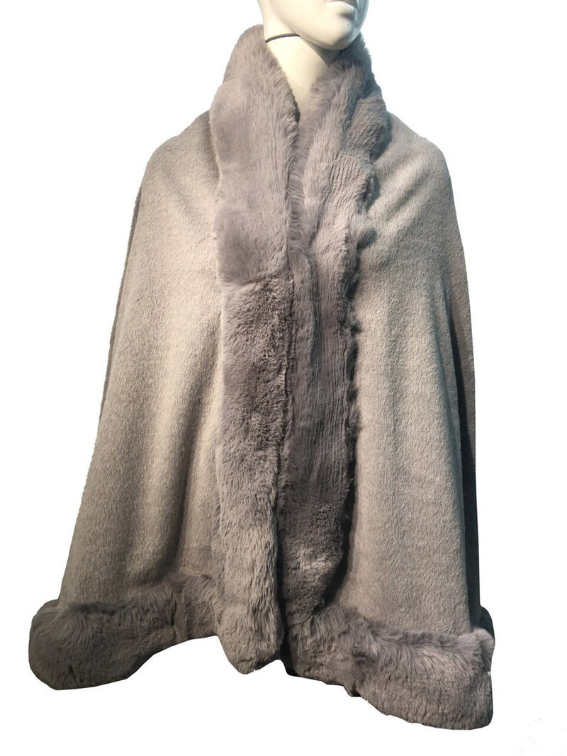 Soft gray faux fur poncho cape with a plush collar and detailed edging, perfect for layering in Long Island boutique fashion.