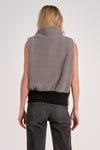 Cozy gray zip-up vest with a high collar and elastic hem, perfect for layering in Long Island boutique fashion.