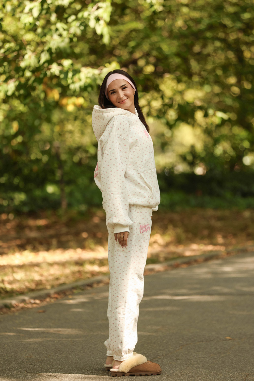 Lightweight joggers featuring a delicate pink floral pattern on a white background, perfect for relaxed days in Long Island boutique fashion.