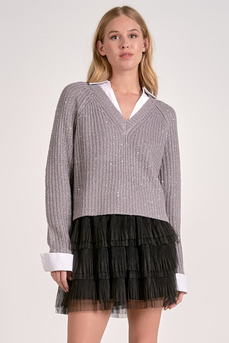 Soft gray V-neck sweater with sequin details and a stylish collar, paired with a black layered tulle skirt, perfect for Long Island boutique fashion.