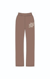 Comfortable brown sweatpants with a relaxed fit featuring the phrase "YOUR FEELINGS ARE SAFE HERE," perfect for Long Island boutique fashion.