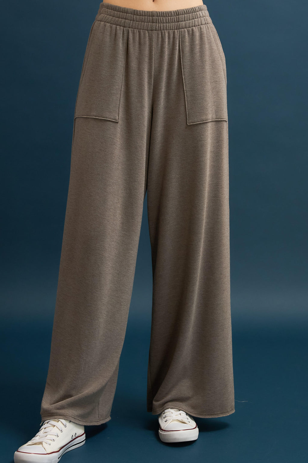 Soft French terry wide leg pants in a cozy taupe color, featuring front pockets and an elastic waistband, perfect for Long Island boutique fashion.