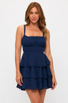 Navy back tie triple-layer mini dress with delicate straps and a fitted bodice, perfect for stylish evenings in Long Island boutique fashion.