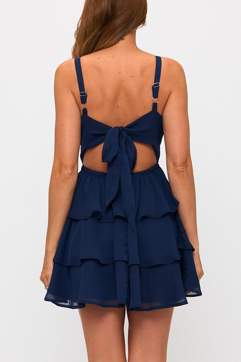 Navy blue back tie mini dress featuring a triple-layered ruffled skirt and adjustable straps, perfect for Long Island boutique fashion.