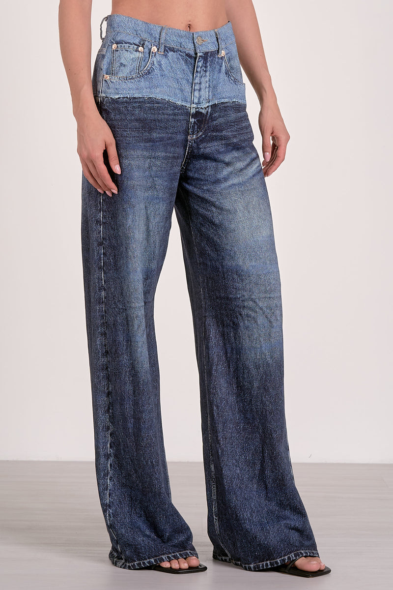 Wide-leg denim pants featuring a trendy two-tone design, perfect for a chic look at this Long Island boutique fashion destination.
