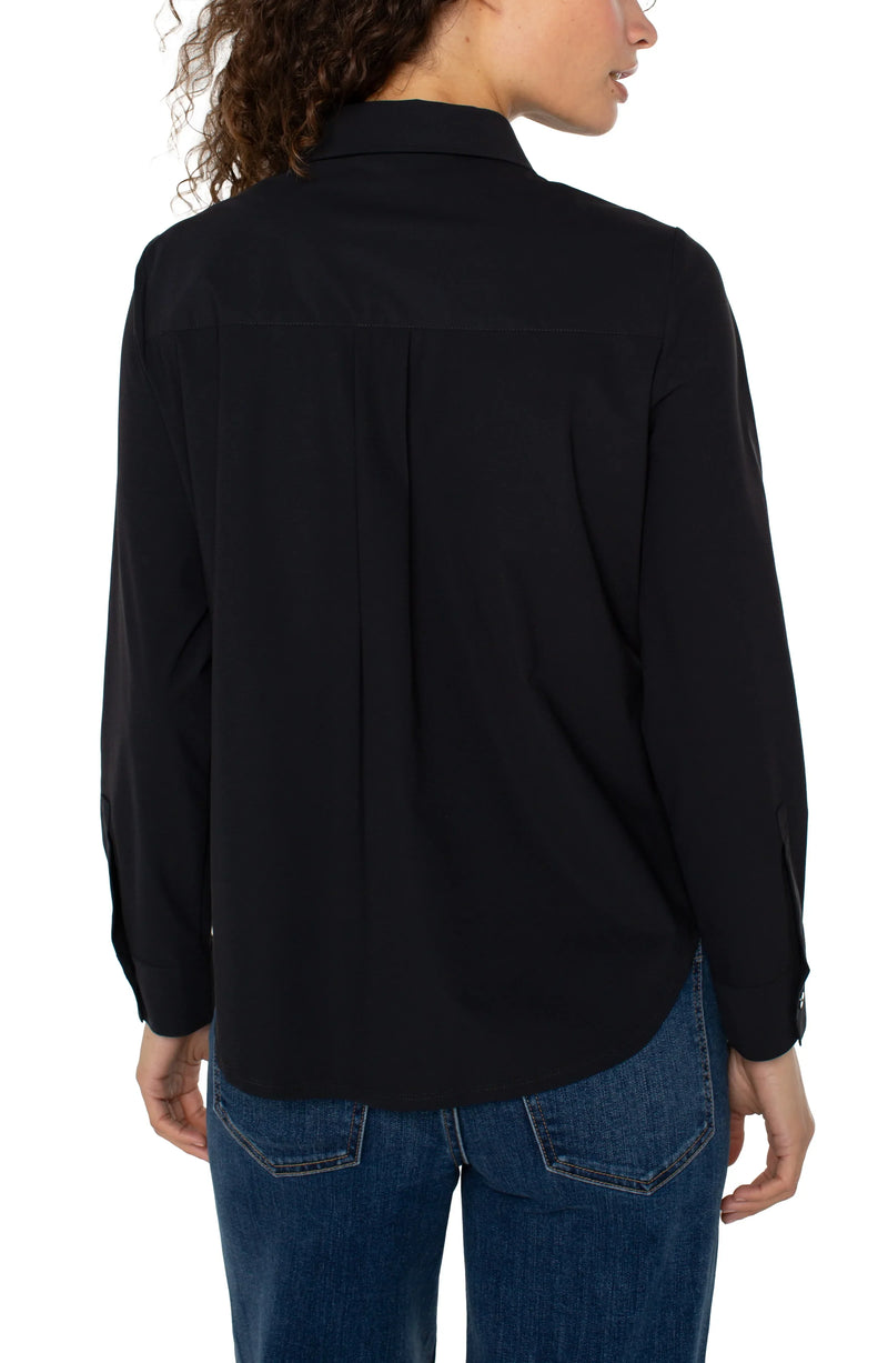 Chic collared zip front knit shirt in classic black, featuring long sleeves and a relaxed fit, perfect for Long Island boutique fashion.