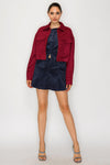 Cropped burgundy suede jacket with dual front pockets and a relaxed fit, ideal for stylish Long Island boutique fashion.