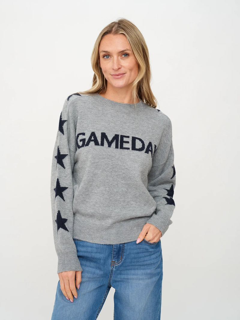 Soft heather gray sweater featuring a "GAMEDAY" graphic and navy star details on the sleeves, perfect for Long Island boutique fashion enthusiasts.