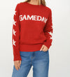 Cozy red sweater featuring bold "GAMEDAY" lettering and star patterns on sleeves, perfect for Long Island boutique fashion enthusiasts.